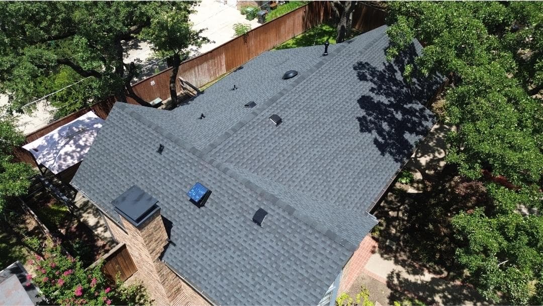 Stunning Charcoal Roof Installation in Peaceful Setting image